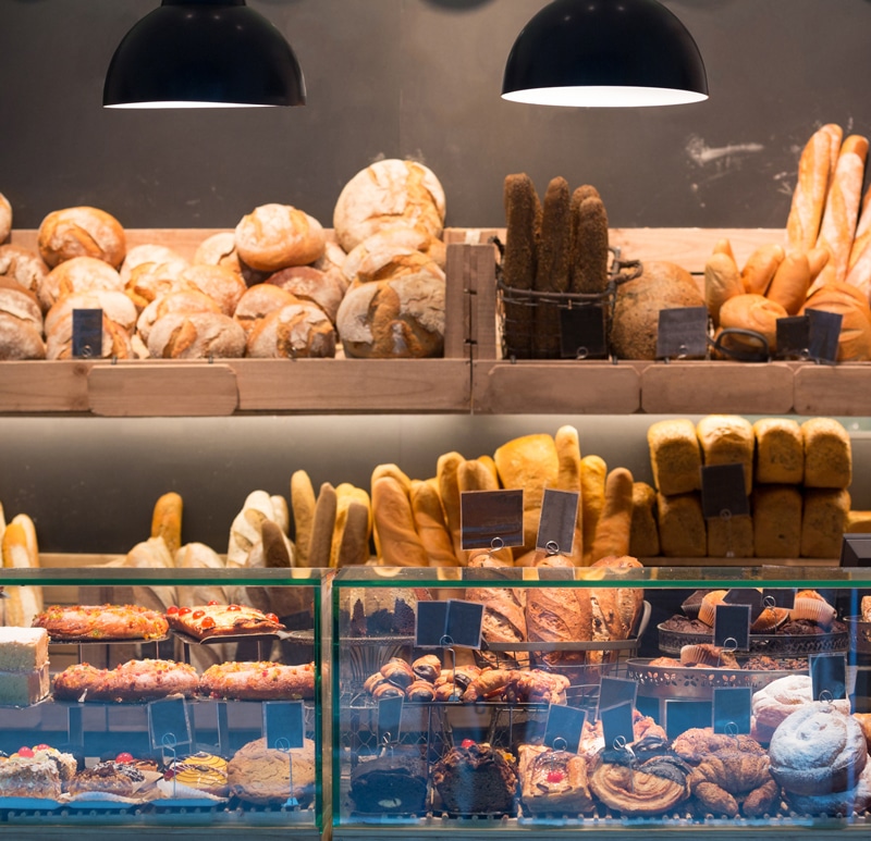 a store filled with lots of different types of donuts on display